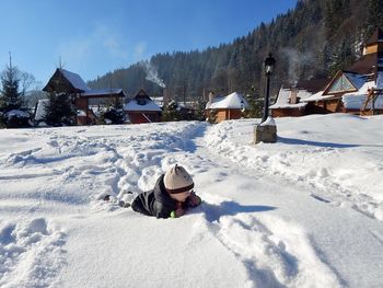 Man in snow on field during winter