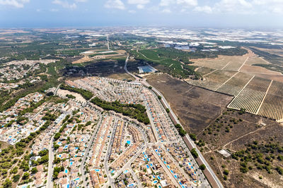 High angle view of city on field against sky