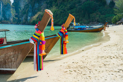 Boats moored on beach