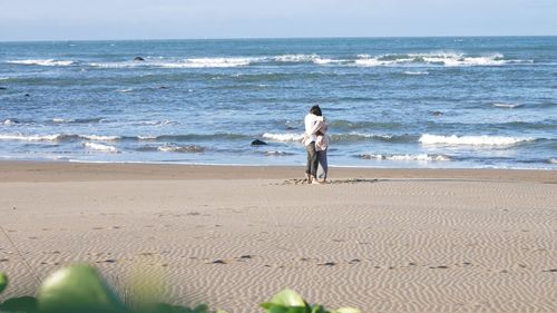 People enjoying at beach