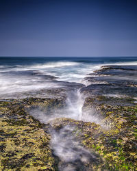 Scenic view of sea against clear sky