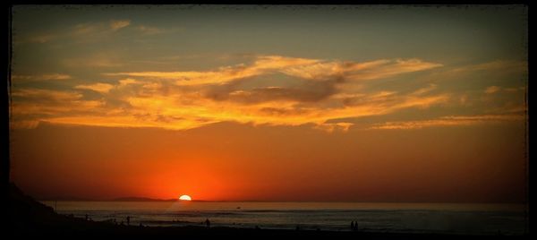 Scenic view of sea at sunset