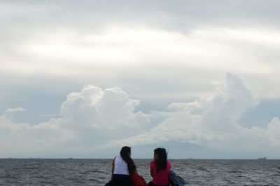 Scenic view of sea against cloudy sky