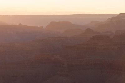 Scenic view of rocky mountains against sky during sunset