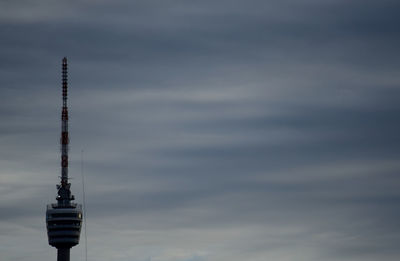 Low angle view of communications tower against sky