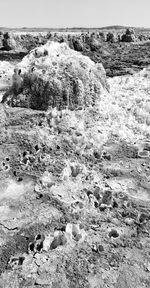 Scenic view of rocks on land against sky