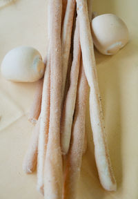 High angle view of breadsticks on table