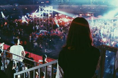 People enjoying music concert at night