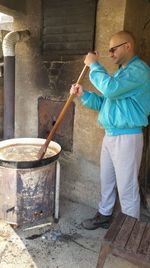 Midsection of man preparing food