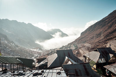 Gangtok, sikkim - dramatic clouds over roof tops of sikimise, nepalis, tibetan buddhist huts.