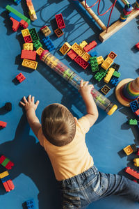 High angle view of girl playing with toy