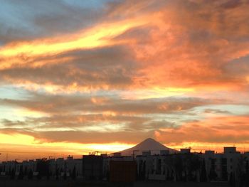 Scenic view of dramatic sky at sunset