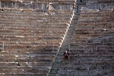 Full length of man standing on steps