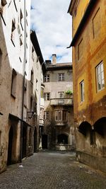 Narrow alley amidst buildings in town