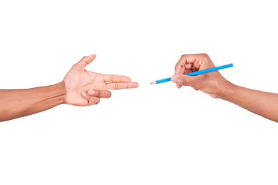 Cropped image of people holding hands over white background