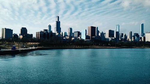 City skyline against cloudy sky