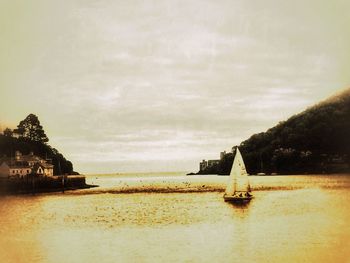 Scenic view of sea against cloudy sky