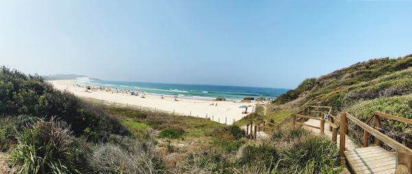 Scenic view of beach against clear sky