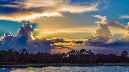 Scenic view of lake against sky during sunset