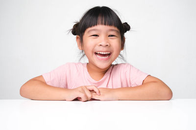 Happy girl against white background