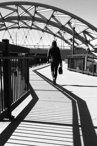 Full length of woman walking on road