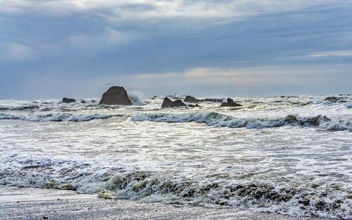 Waves break over rocks at ruby beach in washington state.