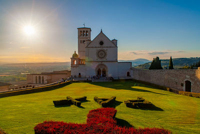 Scenic view of saint francis basilica in assisi, umbria, italy, at sunset