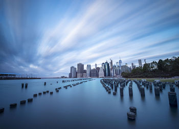 Manhattan glows across east river nyc