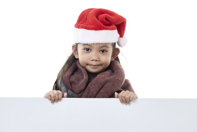 Portrait of cute baby against white background