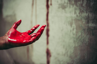 Close-up of wet red water on wall