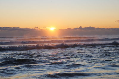 Scenic view of sea against sky during sunset