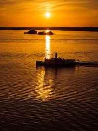 Scenic view of sea at sunset