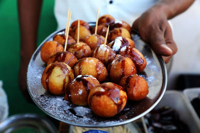 Midsection of man preparing food