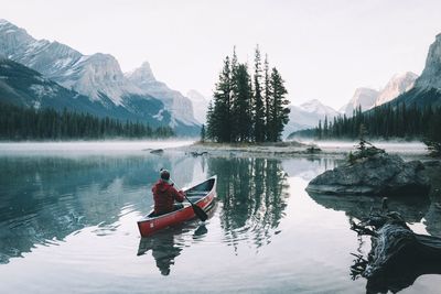 Scenic view of calm lake against mountain range