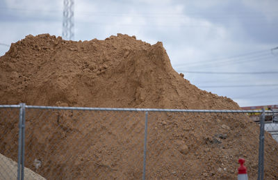 Low angle view of construction site against sky