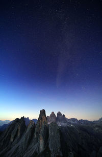 Scenic view of mountains against sky at night