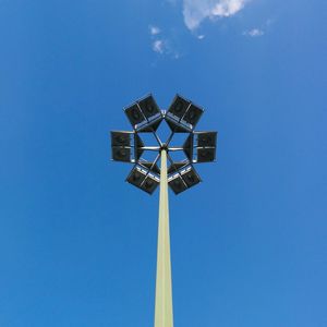 Low angle view of lamp post against blue sky