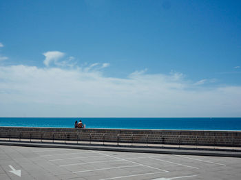 Scenic view of sea against blue sky