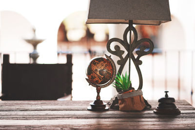 Close-up of electric lamp on table