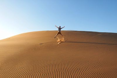 View of desert against clear sky