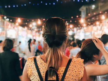 Crowd enjoying music concert at night