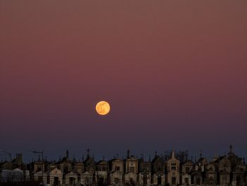 Low angle view of city at sunset