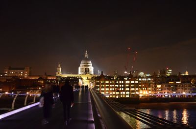 Illuminated buildings in city at night