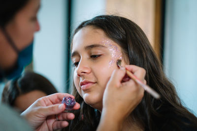 Teen girl makeup with glitter