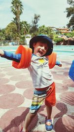 Portrait of happy boy in swimming pool