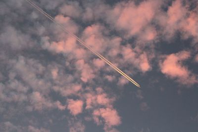 Low angle view of vapor trails in sky