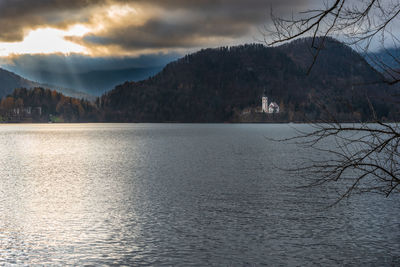 Scenic view of lake and mountains against sky