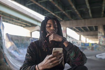 Young woman using mobile phone