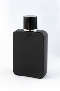 Close-up of beer bottle against white background