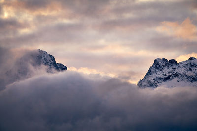 Low angle view of snowcapped mountain against sky during sunset